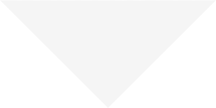 Gray triangle graphic that points downward.