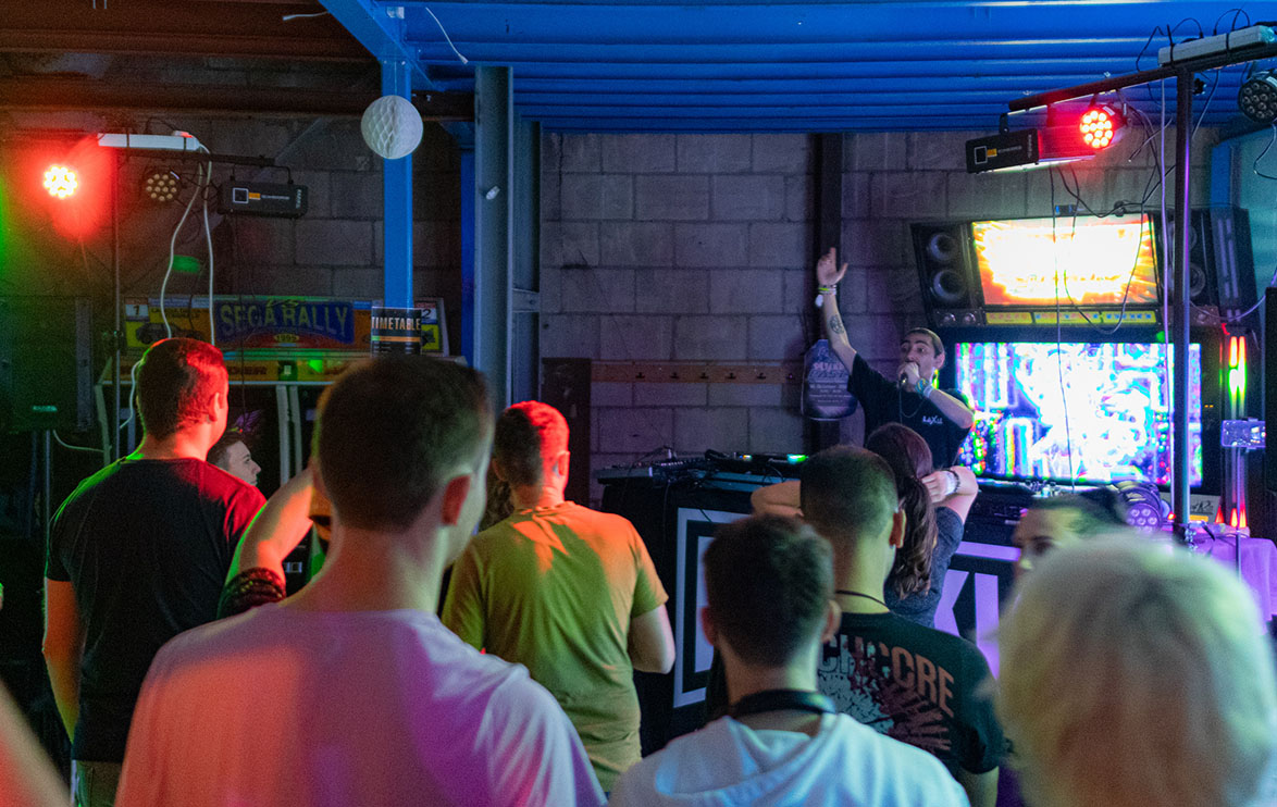Image of crowd at a rave. POV facing the DJ.