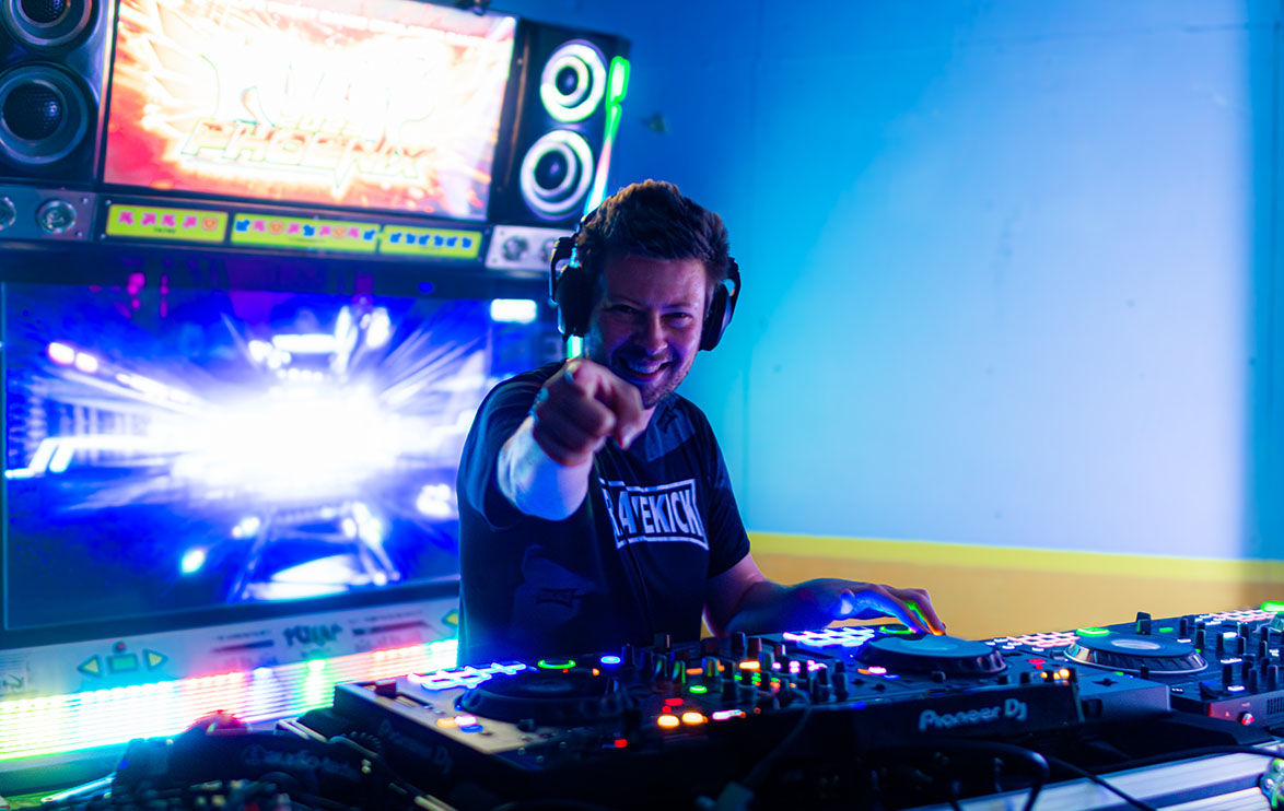 Image of DJ pointing at the camera.